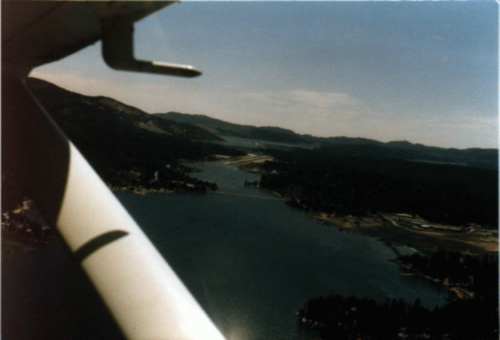 A picture of my plane on the  final approach to Big Bear City Airport, with the two lakes in the background. 