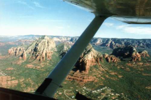 The best picture on this page, well worth the download time. You see a well-contrasted view of   typical Red Rock County landscape under my wings.